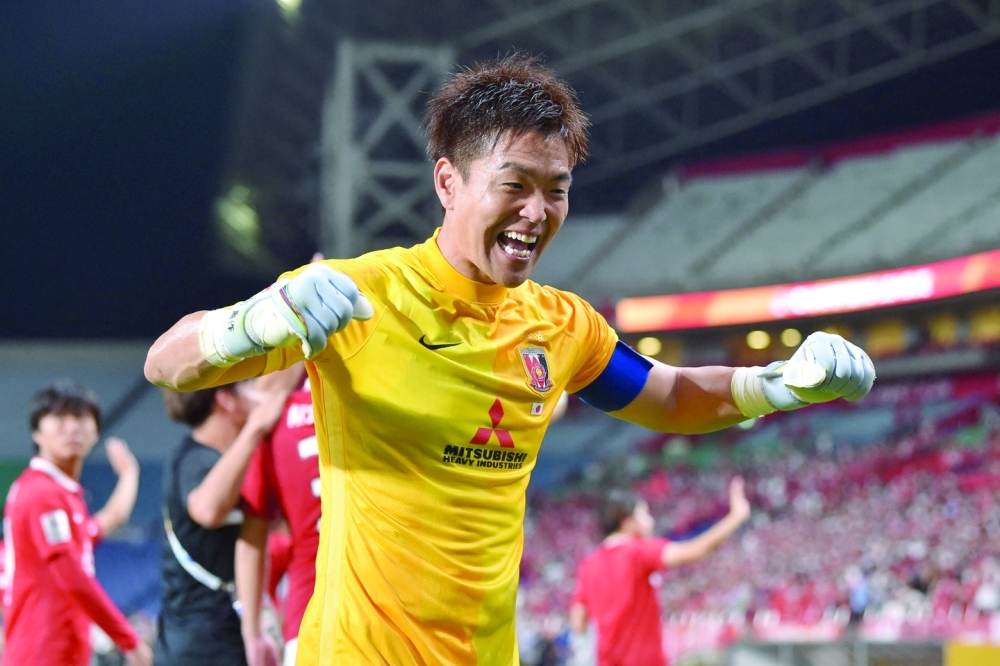 Japan's Urawa Red Diamonds' goalkeeper Shusaku Nishikawa reacts after  making save during penalty shoot-out during the AFC Champions League  semifinal match Urawa Red Diamonds and Jeonbuk Hyundai Motors at Saitama  Stadium Thursday