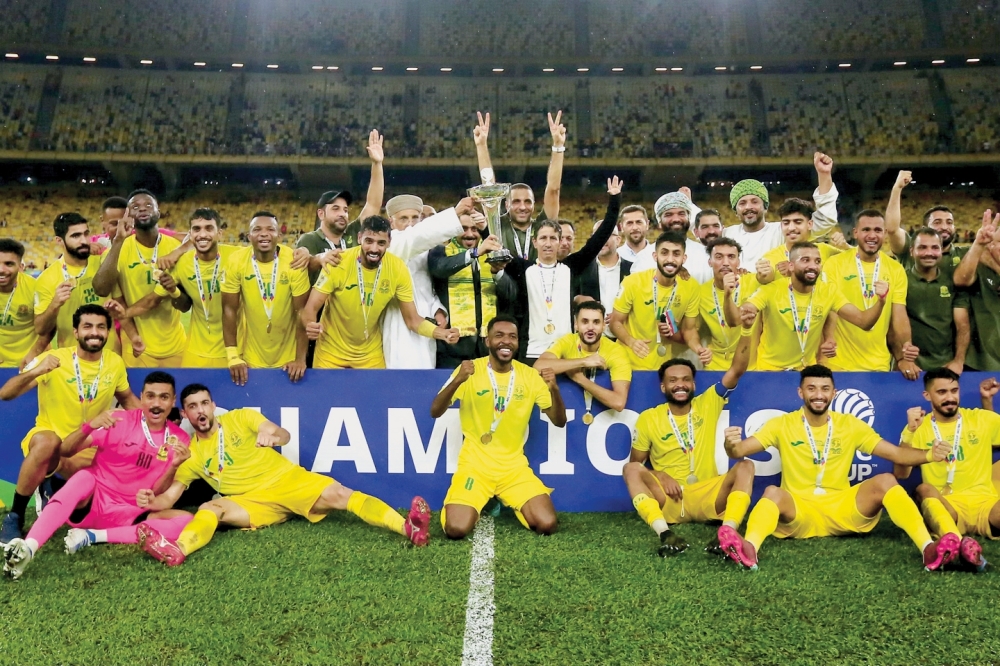 Al Seeb Club players and officials celebrate victory after the AFC Cup 2022  Final match between